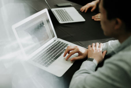 Person typing on laptop